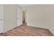 Bedroom featuring wood-look floors and a view of the hallway through an open door at 9563 Grapeland Ave, Las Vegas, NV 89148