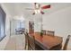 Dining area featuring a chandelier and large wooden table with view of kitchen at 9563 Grapeland Ave, Las Vegas, NV 89148
