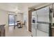 Bright eat-in kitchen featuring stainless steel refrigerator and sliding doors to the backyard at 9563 Grapeland Ave, Las Vegas, NV 89148