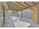 Covered outdoor patio with concrete floor perfect for entertaining and relaxation at 9563 Grapeland Ave, Las Vegas, NV 89148