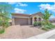 Charming home featuring a tile roof, desert landscaping and a brick paver driveway at 9590 Smiley Creek St, Las Vegas, NV 89178