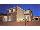 Two-story home with desert landscaping, a two-car garage, and a covered front porch at 972 Orchid Vine Ct, Las Vegas, NV 89183