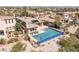 A luxurious desert home features a sparkling pool with integrated spa and solar panels for energy efficiency at 11473 Glowing Sunset Ln, Las Vegas, NV 89135