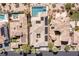 Overhead aerial view of a luxury home with solar panels and pristine pool with spa in a desert landscape at 11473 Glowing Sunset Ln, Las Vegas, NV 89135