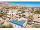 Desert home boasts an inviting pool, mountain views and lush surroundings in a desirable neighborhood at 11473 Glowing Sunset Ln, Las Vegas, NV 89135