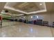 Brightly lit exercise room with mirrors, wood floors, and a variety of fitness equipment at 11473 Glowing Sunset Ln, Las Vegas, NV 89135