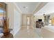Elegant foyer with marble floors and a view into the living room at 11473 Glowing Sunset Ln, Las Vegas, NV 89135