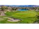 Expansive view of the lush golf course, with meticulously manicured greens and sand traps at 11473 Glowing Sunset Ln, Las Vegas, NV 89135