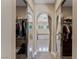 Hallway to main bathroom with stand alone tub and large walk in closets with lots of storage at 11473 Glowing Sunset Ln, Las Vegas, NV 89135