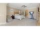 Spacious bedroom features a ceiling fan, fireplace, sitting area, and lots of natural light at 11473 Glowing Sunset Ln, Las Vegas, NV 89135
