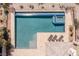 Aerial view of pool, hot tub and three lounge chairs at 11473 Glowing Sunset Ln, Las Vegas, NV 89135