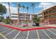 Apartment community pool area with mature palm trees and red rock landscaping at 1381 E University Ave # 301, Las Vegas, NV 89119