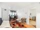 Cozy living room with wood floors, white walls, large window and an open doorway at 1381 E University Ave # 301, Las Vegas, NV 89119