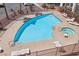 Aerial view of the community pool with lounge chairs and a spa at 1381 E University Ave # 301, Las Vegas, NV 89119