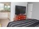 Bedroom with mirrored closet doors, carpeted floors and neutral paint at 2080 Karen Ave # 21, Las Vegas, NV 89169