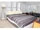 Bedroom with mirrored closet doors, carpeted floors and neutral paint at 2080 Karen Ave # 21, Las Vegas, NV 89169