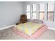 Bedroom featuring carpeted floors, neutral paint and three windows at 2080 Karen Ave # 21, Las Vegas, NV 89169