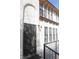 View of the front entry with a security door, and stucco walls at 2080 Karen Ave # 21, Las Vegas, NV 89169
