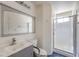 Updated bathroom featuring a glass shower, and gray vanity at 2180 Maple Shade St, Henderson, NV 89002