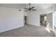Relaxing bedroom with neutral carpet, ceiling fan, and en-suite bathroom access at 2180 Maple Shade St, Henderson, NV 89002