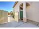 Inviting entrance to this home featuring a well-manicured lawn and a vibrant green front door at 2180 Maple Shade St, Henderson, NV 89002