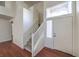 Bright entryway showcasing stairs with white banisters and wood-look flooring at 2180 Maple Shade St, Henderson, NV 89002