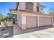 Charming two-story home featuring a two-car garage, a walkway, and a front yard at 2180 Maple Shade St, Henderson, NV 89002