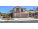 Charming two-story home featuring a two-car garage and well-maintained front yard at 2180 Maple Shade St, Henderson, NV 89002