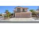 Charming two-story home featuring a two-car garage and well-maintained front yard at 2180 Maple Shade St, Henderson, NV 89002