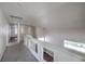 Second-floor hallway boasts carpet flooring and a window view at 2180 Maple Shade St, Henderson, NV 89002