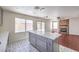 Updated kitchen with an island, stone fireplace, and modern finishes throughout at 2180 Maple Shade St, Henderson, NV 89002