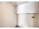 A bright laundry room features built-in cabinetry at 2180 Maple Shade St, Henderson, NV 89002