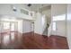Open-concept living room featuring hardwood floors, high ceilings, and a staircase at 2180 Maple Shade St, Henderson, NV 89002