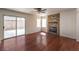 Cozy living room featuring hardwood floors, fireplace, and sliding glass doors at 2180 Maple Shade St, Henderson, NV 89002