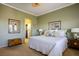 Comfortable bedroom with green walls, carpet flooring, and neutral accents at 2720 Spalding Dr, Las Vegas, NV 89134