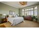 Spacious bedroom with green walls, carpet flooring, and many windows at 2720 Spalding Dr, Las Vegas, NV 89134