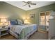 Comfortable bedroom with a cozy bed, soft lighting, and a window with blinds at 2720 Spalding Dr, Las Vegas, NV 89134