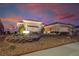 Charming front exterior view showcasing desert rock landscaping, desert plants and mature plantings at 2720 Spalding Dr, Las Vegas, NV 89134