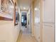 Hallway with artwork and an open doorway to another living space at 2720 Spalding Dr, Las Vegas, NV 89134