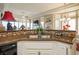 Functional kitchen showcasing a sink, tile backsplash, and modern appliances at 2720 Spalding Dr, Las Vegas, NV 89134