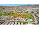 An aerial view showing a community pool, baseball fields, and tennis and basketball courts at 3049 Echoed Rondel Ln, Henderson, NV 89044