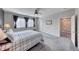 Neutral bedroom featuring modern light fixture, windows, and carpeted floors at 3049 Echoed Rondel Ln, Henderson, NV 89044