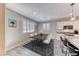 Bright dining area featuring a modern table set, shuttered windows, and stylish decor at 3049 Echoed Rondel Ln, Henderson, NV 89044