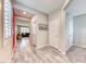 Hallway featuring tile floors and neutral walls, leading into the living spaces of the home at 3049 Echoed Rondel Ln, Henderson, NV 89044