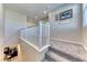 Upstairs hallway features neutral colored walls, white railing, and carpeted floors at 3049 Echoed Rondel Ln, Henderson, NV 89044