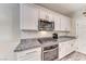 Kitchen featuring granite countertops, stainless steel appliances, and subway tile backsplash at 3049 Echoed Rondel Ln, Henderson, NV 89044