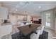 Bright kitchen featuring white cabinets, stainless steel appliances, and an adjacent dining area at 3049 Echoed Rondel Ln, Henderson, NV 89044