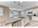 Kitchen featuring granite countertops, stainless steel appliances and a large island at 3049 Echoed Rondel Ln, Henderson, NV 89044