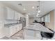 Spacious kitchen with granite countertops, stainless steel appliances, and modern lighting at 3049 Echoed Rondel Ln, Henderson, NV 89044