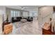 Spacious living room featuring tile floors, staircase and bright windows at 3049 Echoed Rondel Ln, Henderson, NV 89044